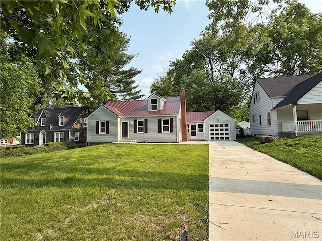 134 N 82nd St, Belleville, IL 62223 - view of front of property featuring a chimney, concrete driveway, metal roof, an outbuilding, and a front yard