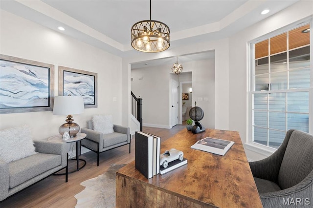 home office with a chandelier, wood finished floors, recessed lighting, and baseboards