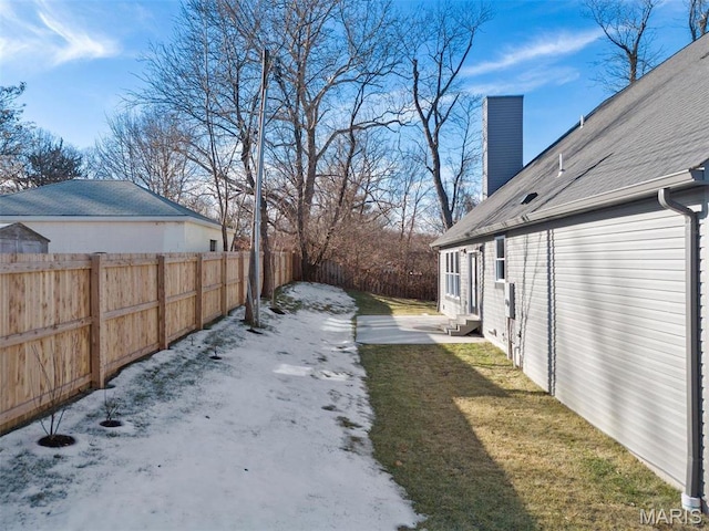 view of yard featuring entry steps and a patio area