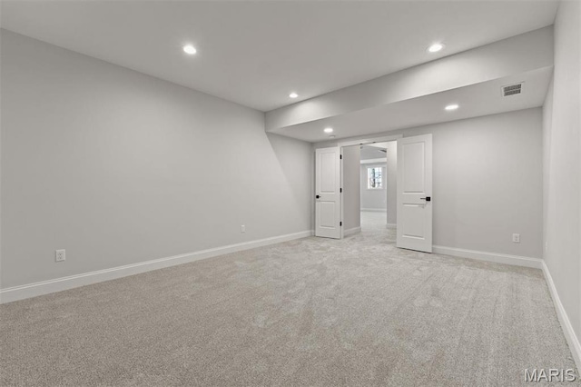 unfurnished bedroom featuring recessed lighting, light colored carpet, and baseboards