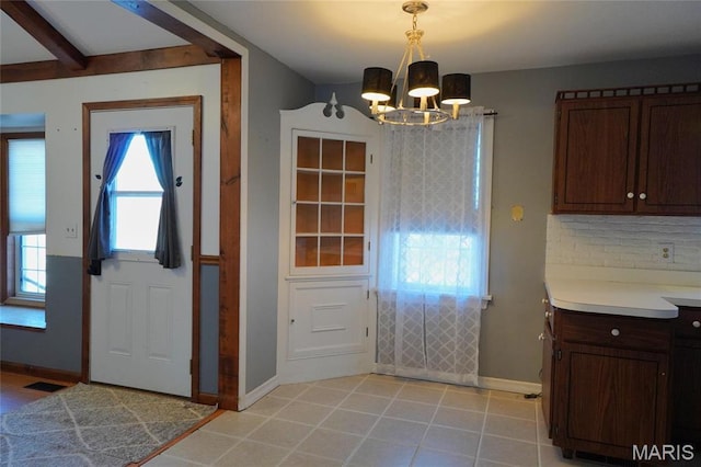 1014 Jefferson St, Hermann, MO 65041 - entryway with a chandelier and baseboards