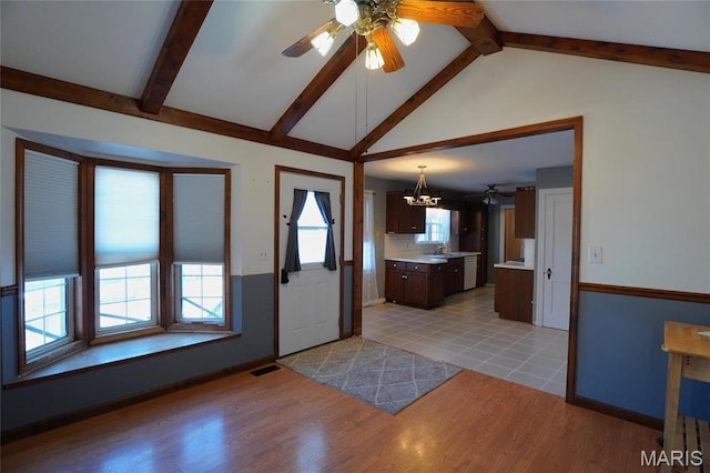 1014 Jefferson St, Hermann, MO 65041 - foyer entrance featuring ceiling fan, light wood-type flooring, and a chandelier