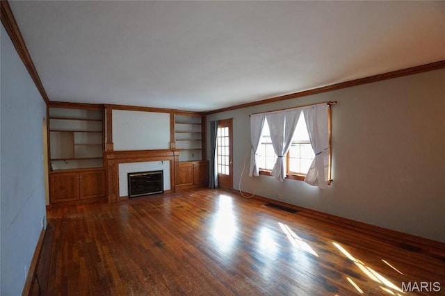 1014 Jefferson St, Hermann, MO 65041 - unfurnished living room with crown molding, dark wood finished floors, a fireplace, and built in features