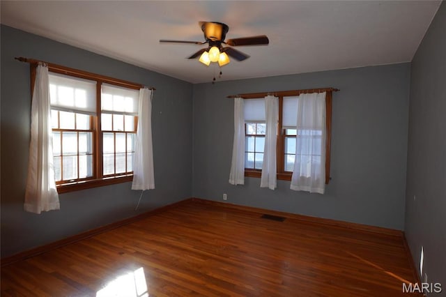 1014 Jefferson St, Hermann, MO 65041 - empty room with wood finished floors and a ceiling fan