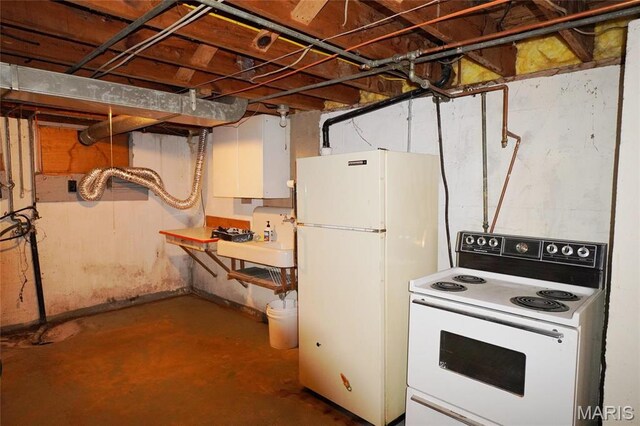1014 Jefferson St, Hermann, MO 65041 - unfinished basement featuring freestanding refrigerator and a sink