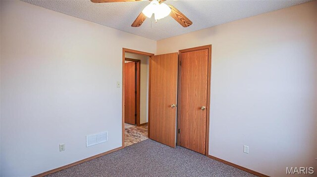 13060 Kimberly Ln, De Soto, MO 63020 - unfurnished bedroom with carpet floors, baseboards, a textured ceiling, and a ceiling fan