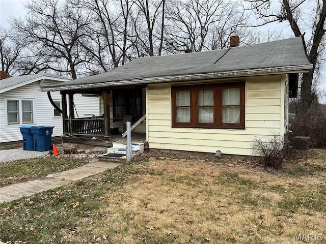 3620 Thomas Ave, Alton, IL 62002 - bungalow-style house with a chimney, a front lawn, a porch, and a shingled roof