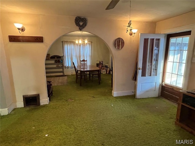 3620 Thomas Ave, Alton, IL 62002 - dining space with arched walkways, a chandelier, carpet floors, and healthy amount of natural light
