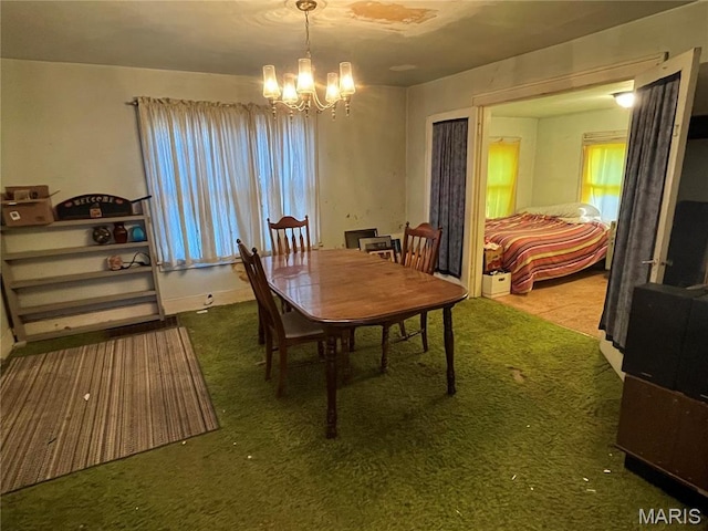 3620 Thomas Ave, Alton, IL 62002 - carpeted dining area with a chandelier