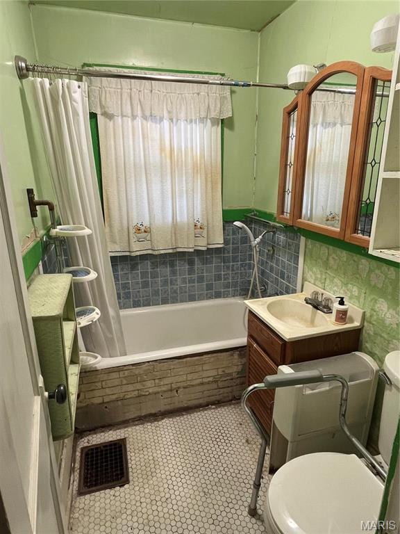 3620 Thomas Ave, Alton, IL 62002 - bathroom featuring toilet, tiled shower / bath combo, and a sink