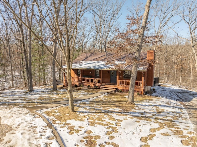 snowy yard with covered porch