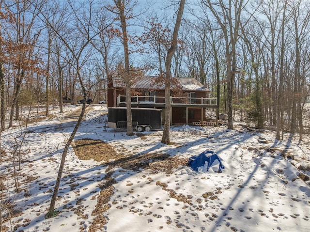 back of property with a wooden deck