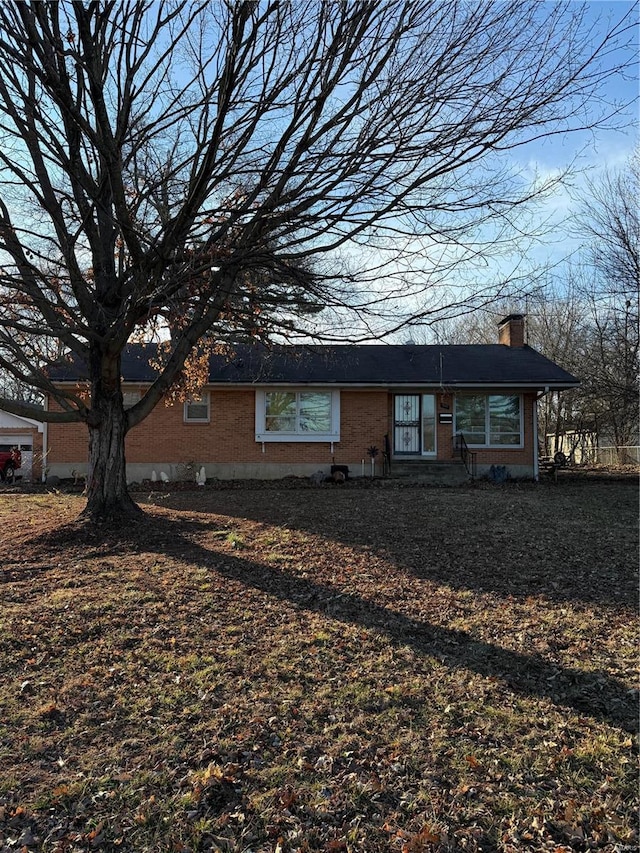 599 N Washington St, Farmington, MO 63640 - view of front of home with a chimney and brick siding