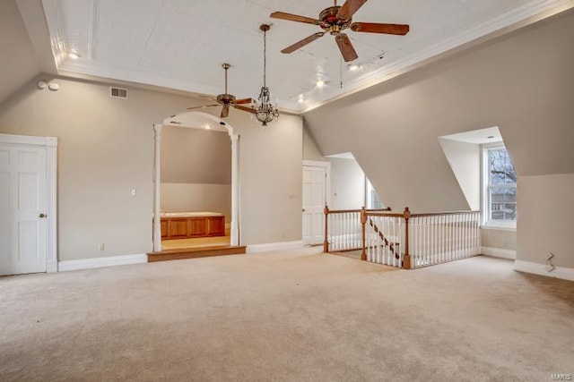 additional living space featuring a ceiling fan, vaulted ceiling, carpet flooring, and baseboards