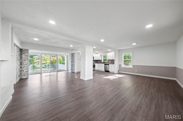 1919 Parker Rd, Saint Louis, MO 63138 - unfurnished living room featuring baseboards, dark wood-type flooring, and recessed lighting