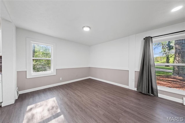 1919 Parker Rd, Saint Louis, MO 63138 - unfurnished room with healthy amount of natural light, dark wood-type flooring, baseboards, and recessed lighting