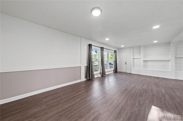 1919 Parker Rd, Saint Louis, MO 63138 - unfurnished living room with dark wood finished floors, baseboards, recessed lighting, and built in shelves