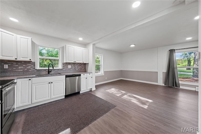 1919 Parker Rd, Saint Louis, MO 63138 - kitchen with a sink, stainless steel appliances, dark wood-style floors, open floor plan, and tasteful backsplash