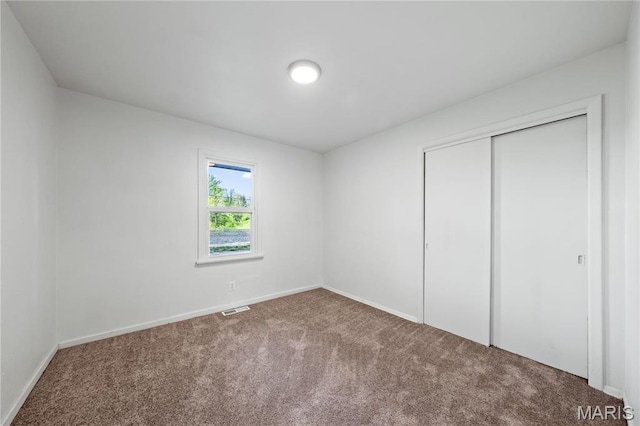1919 Parker Rd, Saint Louis, MO 63138 - unfurnished bedroom with carpet floors, baseboards, and a closet
