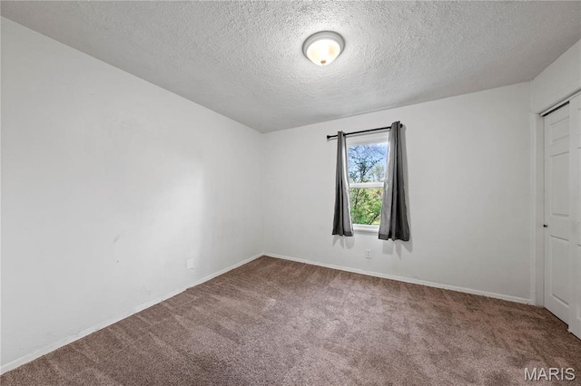 1919 Parker Rd, Saint Louis, MO 63138 - carpeted spare room featuring a textured ceiling and baseboards