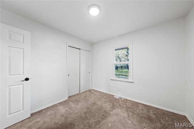 1919 Parker Rd, Saint Louis, MO 63138 - unfurnished bedroom featuring carpet flooring, baseboards, and a closet