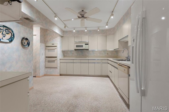 585 Coeur De Royale Dr Unit 206, Creve Coeur, MO 63141 - kitchen with track lighting, white appliances, ceiling fan, light countertops, and white cabinetry