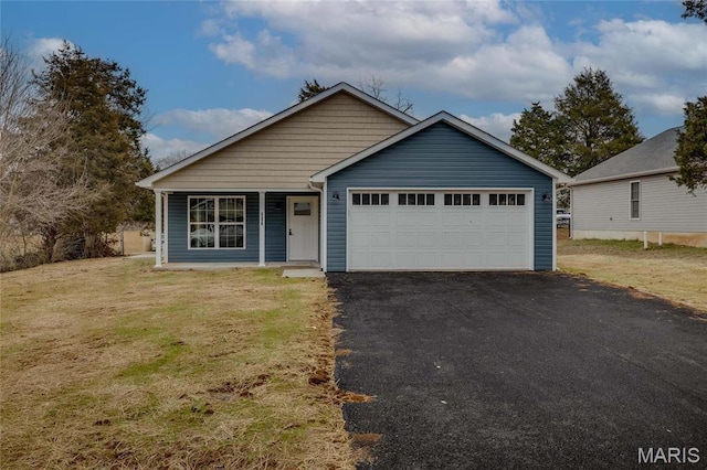 506 S Cantwell Ln, Desloge, MO 63601 - view of front of property with an attached garage, driveway, a front yard, and a porch