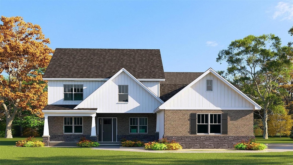 11604 Osanna Ln, Marine, IL 62061 - view of front of property with a front yard, brick siding, a shingled roof, and board and batten siding