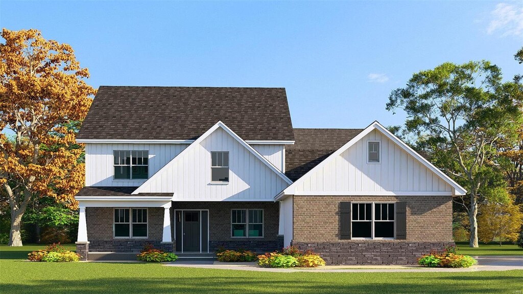 9728 Meriwether Dr, Saint Jacob, IL 62281 - view of front facade featuring a front lawn, brick siding, a shingled roof, and board and batten siding