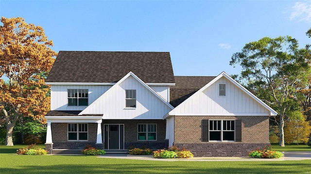 9728 Meriwether Dr, Saint Jacob, IL 62281 - view of front facade featuring a front lawn, brick siding, a shingled roof, and board and batten siding