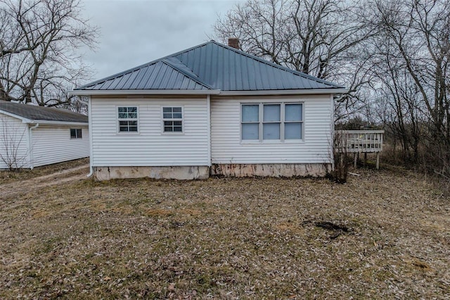 1311 Beck, Lebanon, MO 65536 - back of property with a deck and metal roof