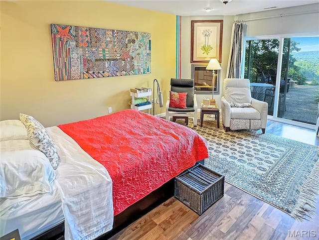 501 4th St W, Hermann, MO 65041 - bedroom with access to exterior and wood finished floors