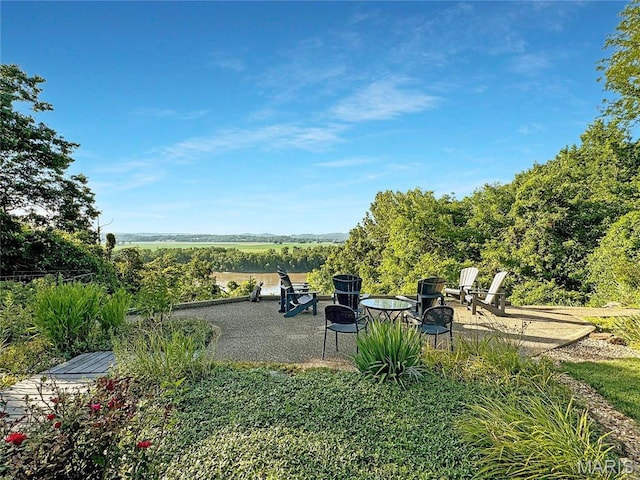 501 4th St W, Hermann, MO 65041 - view of yard featuring a patio area and an outdoor fire pit
