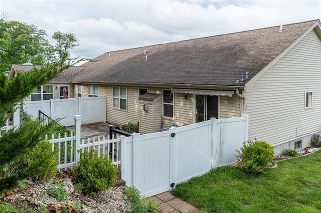 14 Club Ct, Union, MO 63084 - back of house featuring a shingled roof and fence
