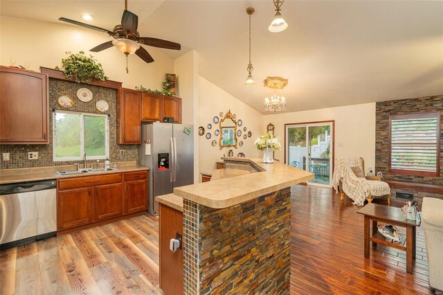 14 Club Ct, Union, MO 63084 - kitchen with appliances with stainless steel finishes, a sink, light countertops, light wood-style floors, and high vaulted ceiling