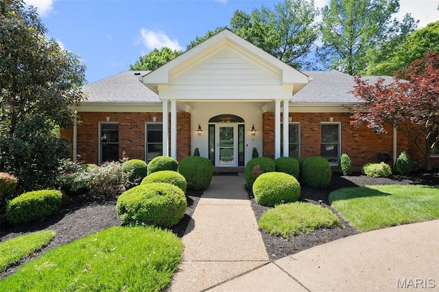 29 Spoede Ln, Creve Coeur, MO 63141 - view of front of property featuring brick siding, a porch, and roof with shingles