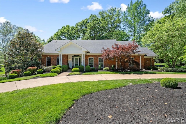29 Spoede Ln, Creve Coeur, MO 63141 - neoclassical / greek revival house featuring brick siding, a front yard, and curved driveway