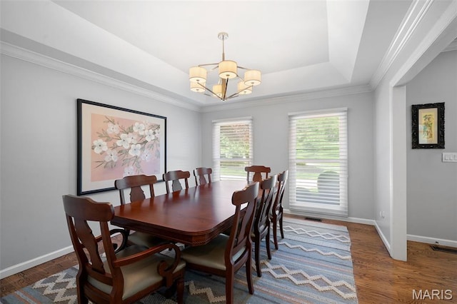 29 Spoede Ln, Creve Coeur, MO 63141 - dining area featuring a chandelier, a raised ceiling, wood finished floors, and ornamental molding
