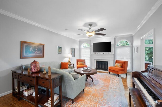 29 Spoede Ln, Creve Coeur, MO 63141 - living area featuring wood finished floors, ceiling fan, crown molding, a fireplace, and healthy amount of natural light