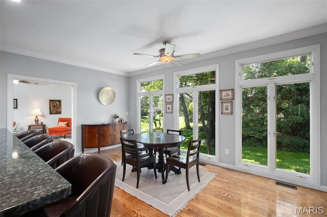 29 Spoede Ln, Creve Coeur, MO 63141 - dining area with a ceiling fan, ornamental molding, and light wood-style floors