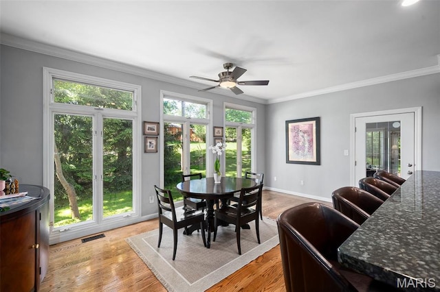 29 Spoede Ln, Creve Coeur, MO 63141 - dining room featuring ornamental molding, ceiling fan, and light wood finished floors