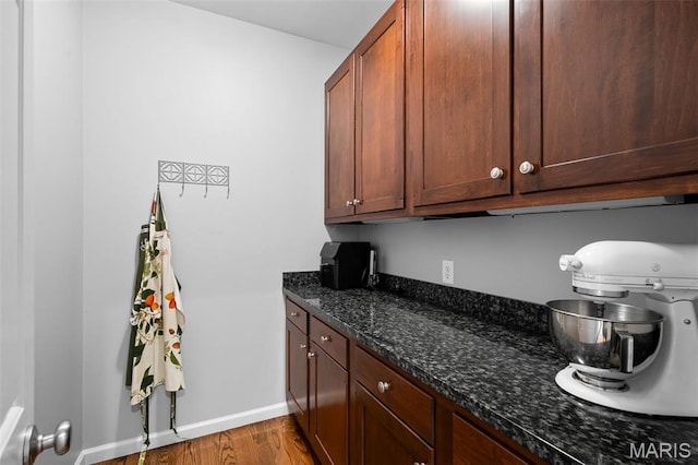 29 Spoede Ln, Creve Coeur, MO 63141 - kitchen featuring wood finished floors and dark stone counters