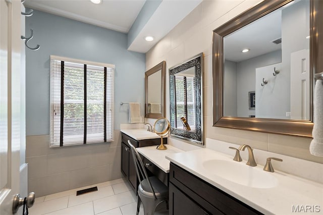 29 Spoede Ln, Creve Coeur, MO 63141 - bathroom with vanity, healthy amount of natural light, tile walls, tile patterned floors, and recessed lighting