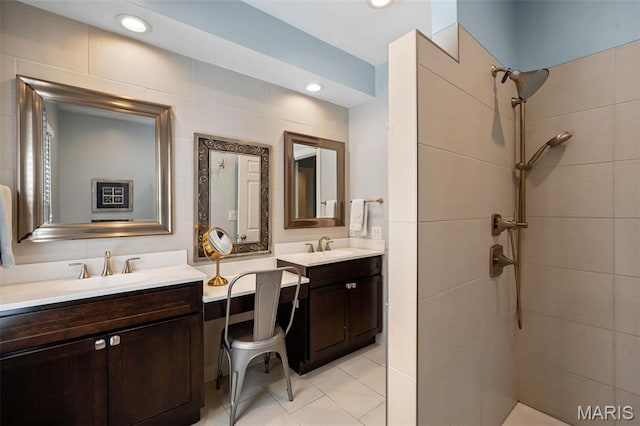 29 Spoede Ln, Creve Coeur, MO 63141 - bathroom with double vanity, tiled shower, tile patterned floors, and recessed lighting