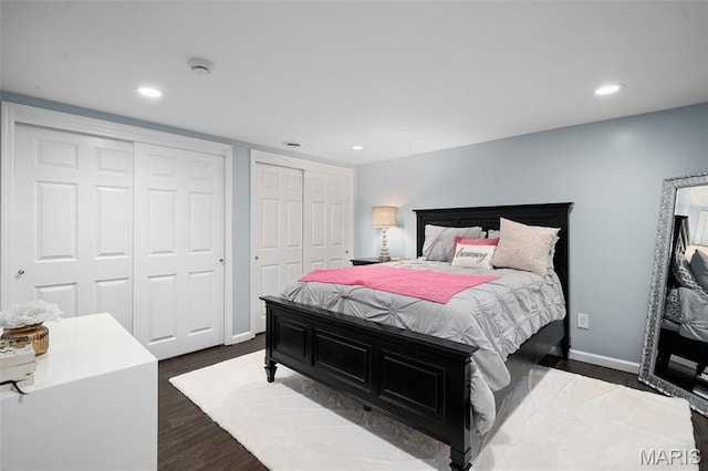 29 Spoede Ln, Creve Coeur, MO 63141 - bedroom featuring two closets, dark wood-type flooring, and recessed lighting