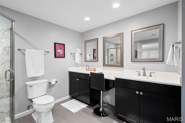 29 Spoede Ln, Creve Coeur, MO 63141 - bathroom featuring double vanity, a marble finish shower, recessed lighting, and wood finished floors