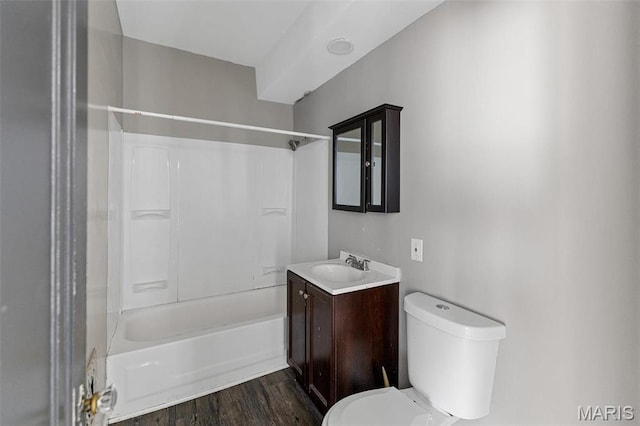 4263 Norfolk Ave Unit 2W, Saint Louis, MO 63110 - bathroom with toilet, vanity, washtub / shower combination, and wood finished floors