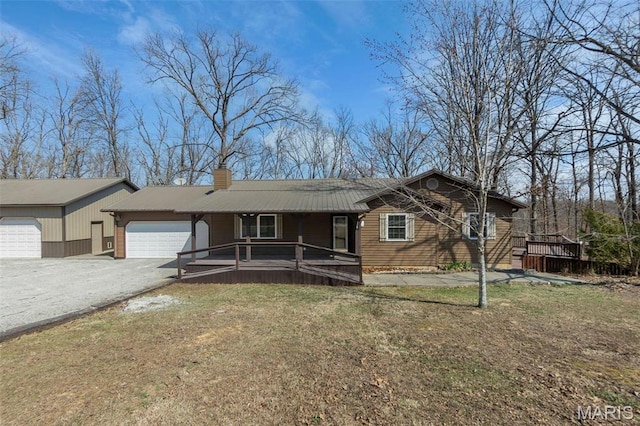 732 Woodridge Ln, Perryville, MO 63775 - ranch-style home with a porch, an attached garage, a chimney, driveway, and metal roof