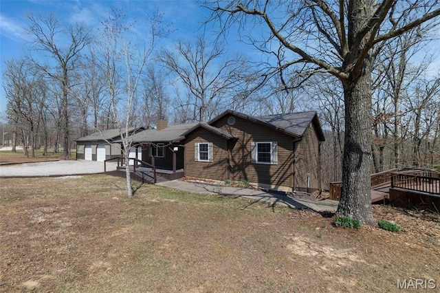 732 Woodridge Ln, Perryville, MO 63775 - view of front of house with a chimney, driveway, a porch, and a wooden deck