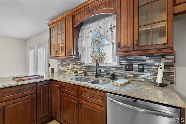 732 Woodridge Ln, Perryville, MO 63775 - kitchen with stainless steel dishwasher, a sink, backsplash, light stone countertops, and glass insert cabinets